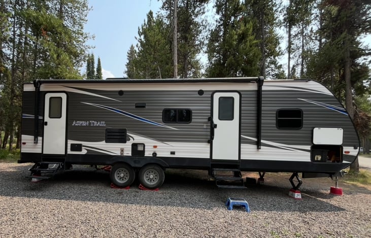 The Wandering Wonder! Our amazing 32 foot family, and pet, friendly RV.  It sleeps up to 10 people! Note the two doors, one with direct entry to the bathroom.