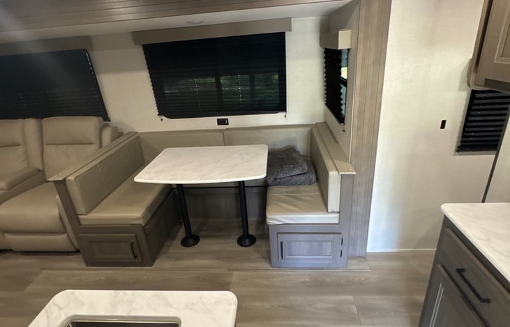 Kitchen table that is horseshoe shaped. Comfortably sits 4.