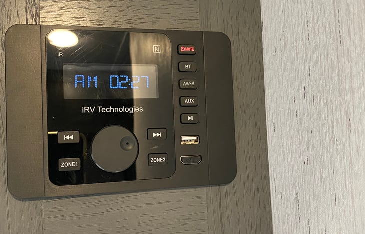 Blue tooth/ USB stereo with selectable inside and or outside speakers.