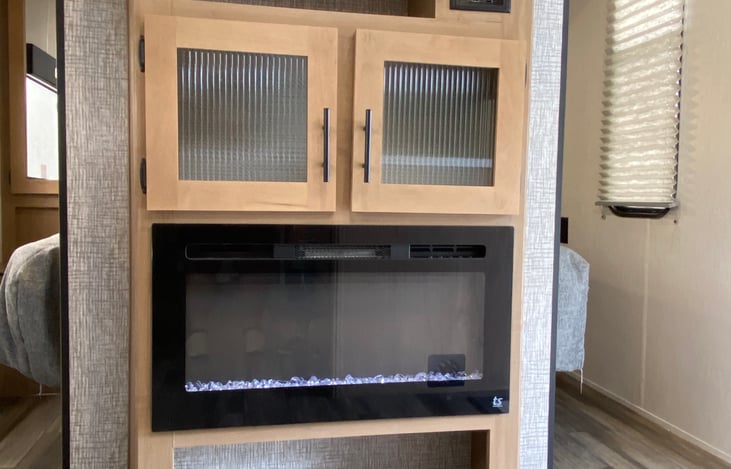 Entertainment center with fireplace and 32" smart tv