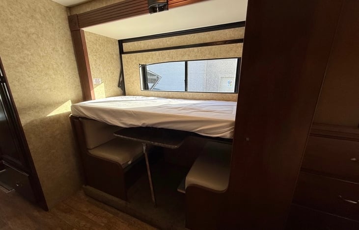 This is the dining area located towards the rear, which can easily be changed into 2 comfy bunks. As seen in the picture, this the top bunk lowered.