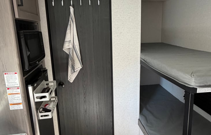 5’9” or under, can sleep comfortably in either bunk and both come with lighting and charging ports