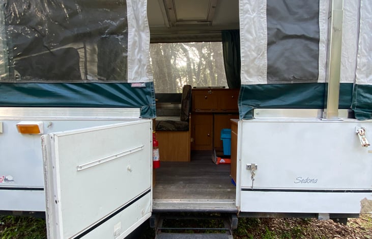 walking in, small half door that locks, and full length door is attached after popped up.