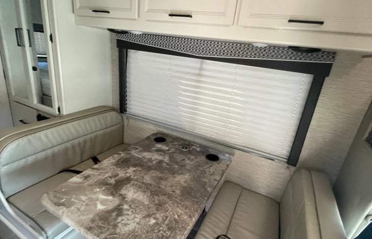 Convertible dinette has two seatbelts and can seat up to four adults.