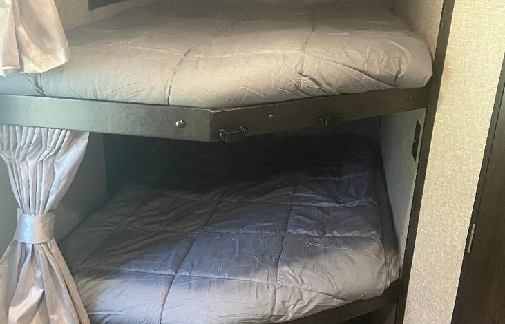 full size bunks - all bedding available for use. Includes 2 pillows per bed! (waterproof mattress pads as well)