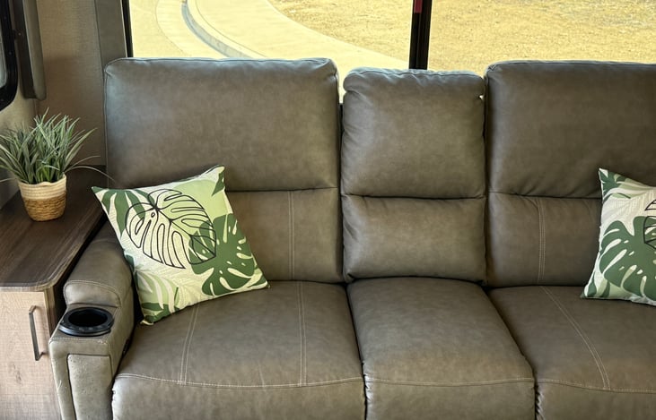 Comfortable recliner sofa with massage and heat. Two recliners and a spot in the middle.