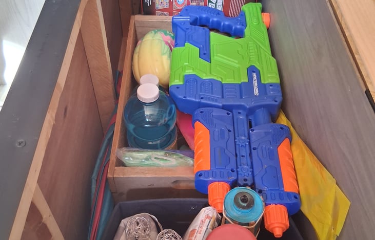 Under the queen bed you will find everything to set up your sitting area outside. And all the fun toys like water blasters, horse shoes, bubbles, basketball, there is also a jug for extra clean water.