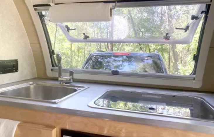 The stove and sink can both be covered to create a continuous countertop space.