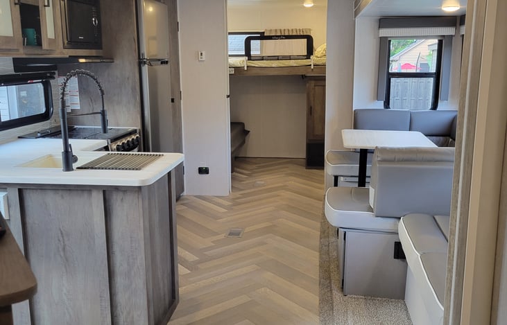 Standing in front of bathroom and master bedroom. Bunk room door open