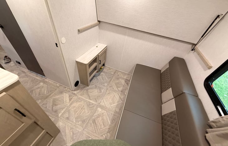 Private bunkhouse room with bunks folded up for lounging time