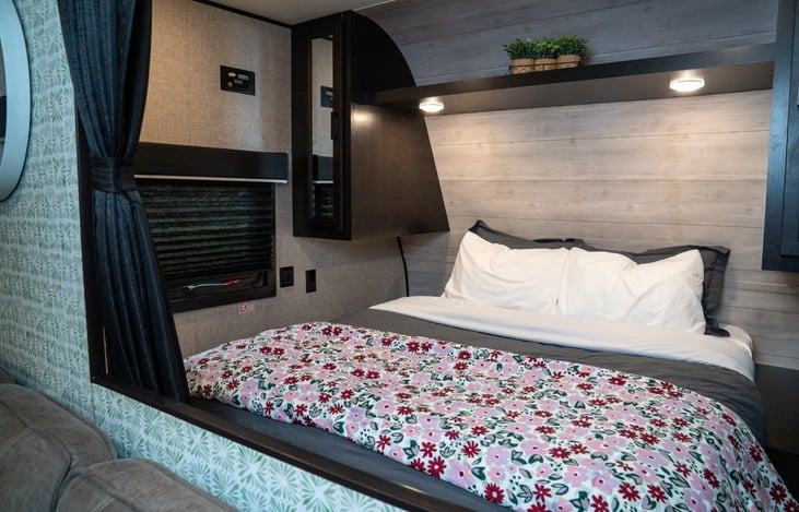 Semi Private primary suite includes a queen sized bed, wardrobe closet and open and closed shelving.  Plus under-bed storage!