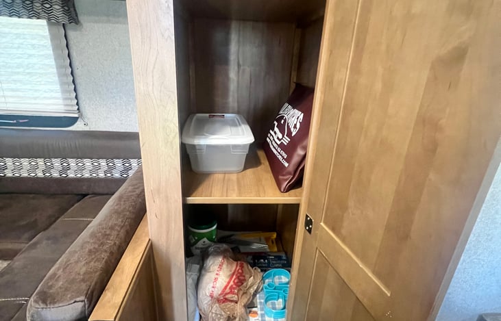 Extra trash bags, games, picnic table cover, etc