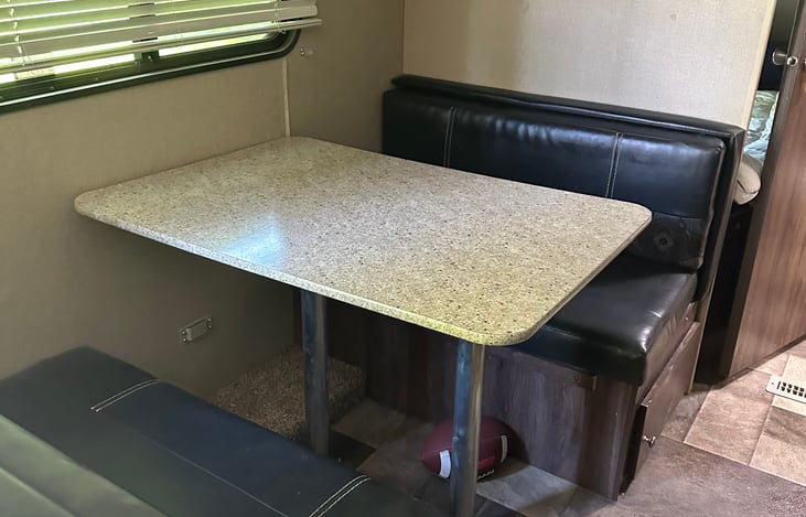 Dining table that converts to bed