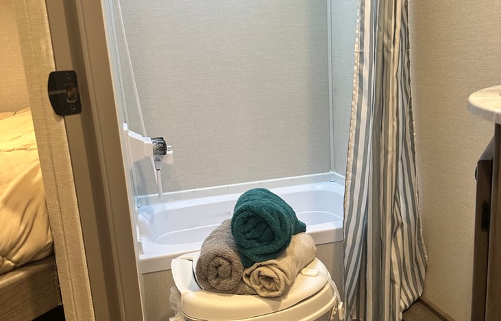 bathroom with shower and tub, detachable shower head