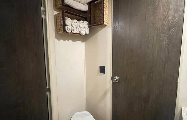 The bathroom has two entrances, one through the living room and one through the primary bedroom!