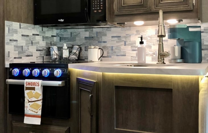 Convenient and clean kitchen area for preparing meals inside.