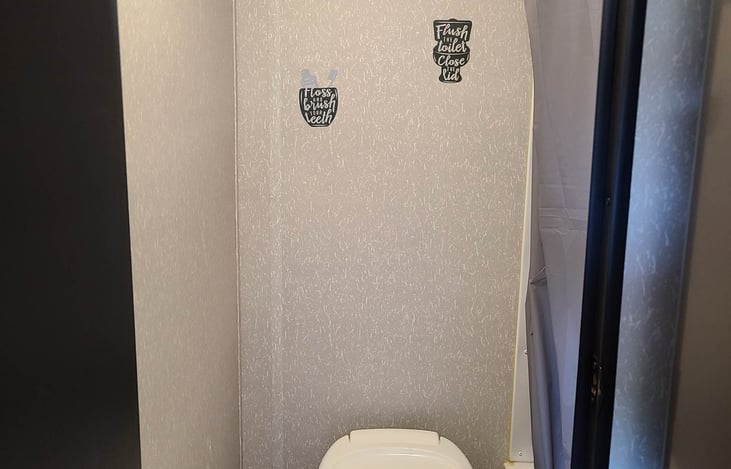 Toilet is easy to flush, RV only toilet paper is included.