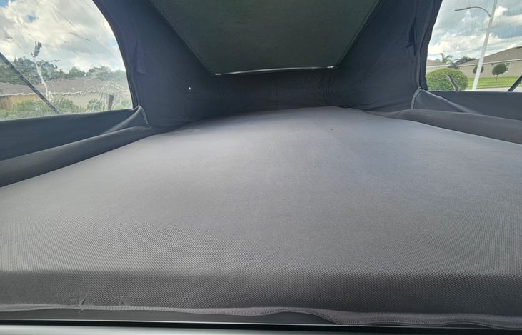 Raised top showing upper bed.