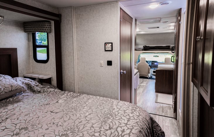 The bathroom door opens to block off the rest of the RV
