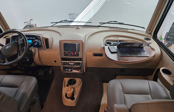 Drivers section, computer desk at passenger seat.