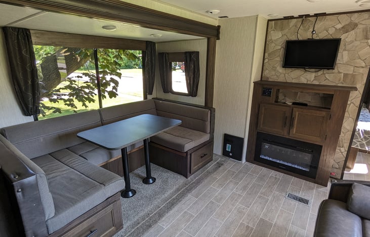 large u-shaped dinette folds down into additional sleeping space