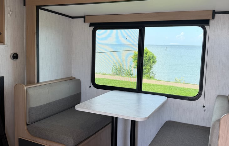 Easy seating with picturesque window. Also, makes into a dinette bed for the littles.
