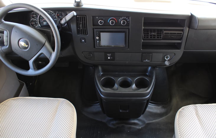 In-dash radio with backup camera, dash airconditioning, USB outlet, and three-compartment cup holder. Cruise control, power steering, and power windows/locks.