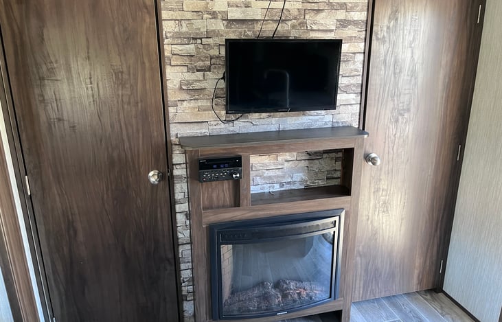 Doors to master bedroom. Cozy fireplace.