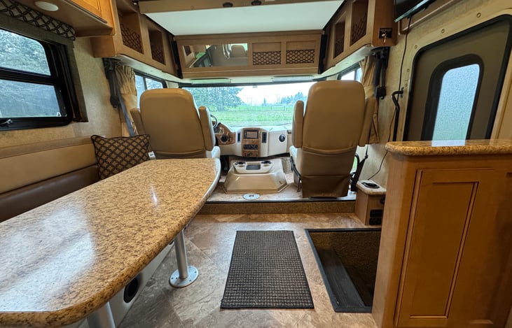 View of table, couch and front cabin