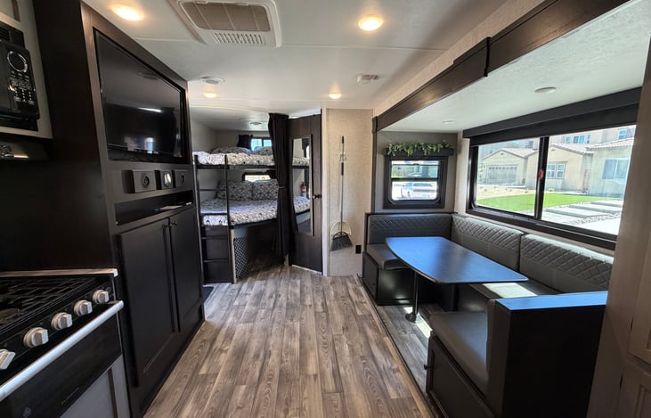 Two full size bunk beds that hold 300lbs each. Bunks have a privacy curtain along with 110 outlets and USB-C ports. Lots of storage available under the bunks.