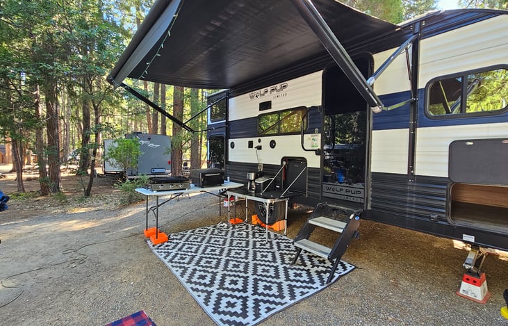 Camper comes with Treager grill, flat top grill, two tables, cooking utensils, pots and pans, and Treager pellets. We also offer two propane tanks during stays 2 nights or longer.