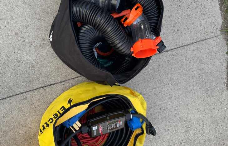 Power, surge protector, waste hose, waste hose supports for full hook up sites, water lines - everything you'll need for camping - Provided