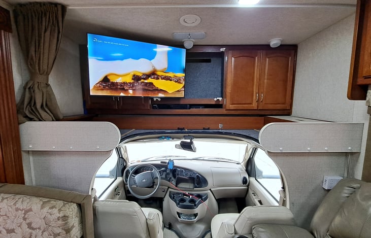 32" TV with smart features, Netflix, Amazon, YouTubeTV, Etc.  WiFi hotspot on board.