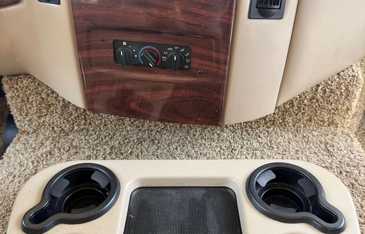 Center council to hold your drinks for total with another cupholder on  driver’s armrest