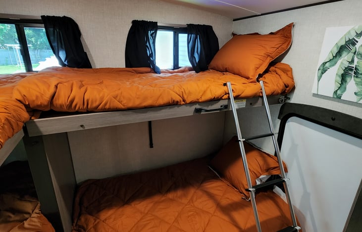 Huge bunk house has two beds that fold up for a great play area or PACK N PLAY.