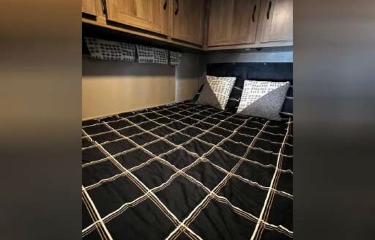 Double bed, with zipper blanket in the back (not pictured is a small TV