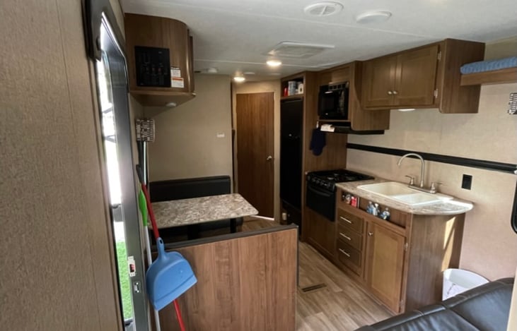 Tv Is now mounted on the wall above the dining table.