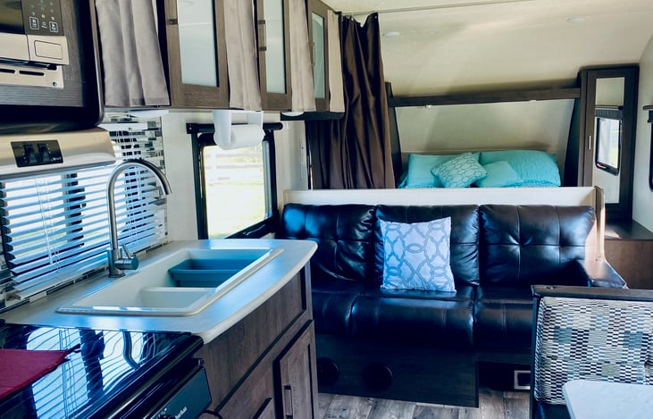 couch converts to a futon style bed. sleeps 2.