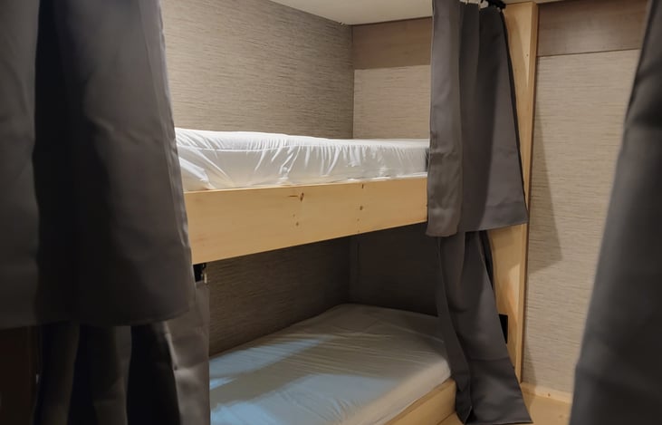 Rear bedroom bunks on passenger side.