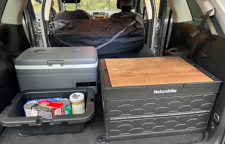 The Dodge Journey has storage bins behind the front seats. These double as ice chests or removable bins to organize your camp.