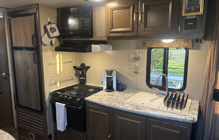 Fully stocked kitchen includes Keurig Coffee maker and coffee/tea.