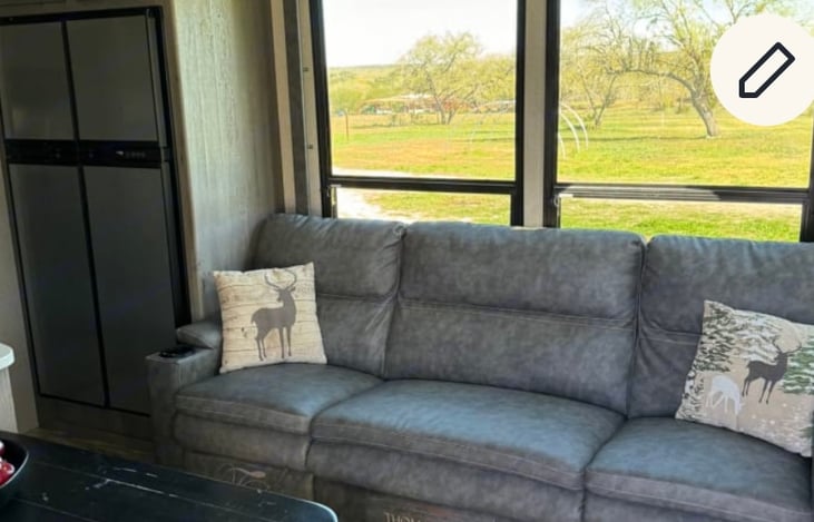 Large reclining sofa with heated seats and vibration.