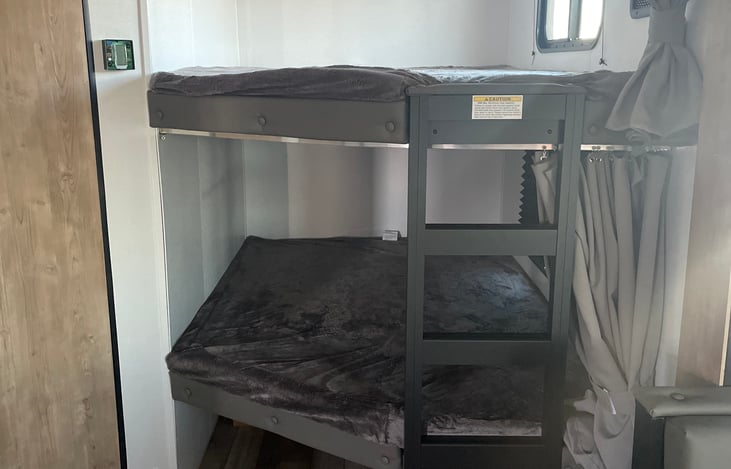 Bunk beds, windows on each.