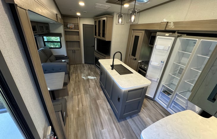 Main living area - huge upright fridge and freezer
