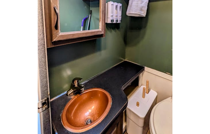 Sink and vanity cabinet
Hand soap, lotion, and sunscreen provided