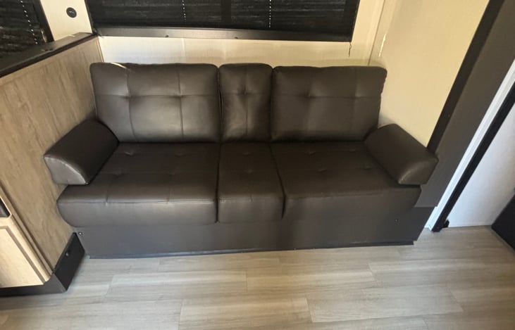 Couch with center arm rest and cup holders
