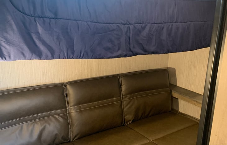 Mid bunk beds. Couch folds down to make a full bed.