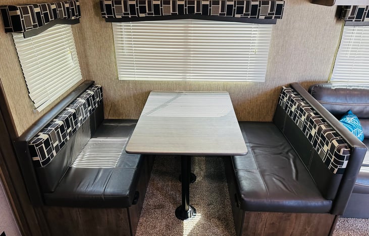 Dinette, breaks down into a bed.