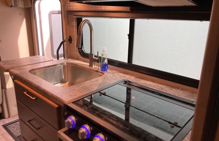 Kitchen with 3 burner stove and oven