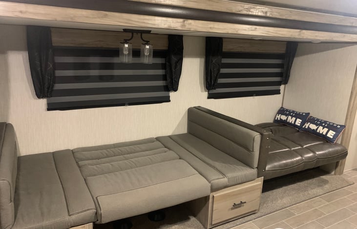 Sofa and dinette folded down for additional sleeping room